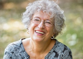 older woman smiling outdoors