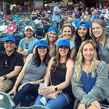Dental team members in stands at sports game