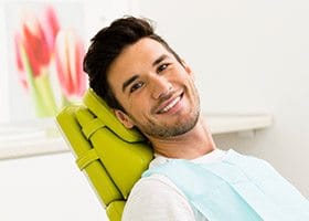 Smiling man in dental chair during general dental checkup in Oklahoma City