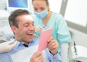 Patient with new dental bridge smiling 