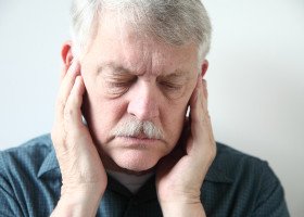 Older man with TMJ disorder