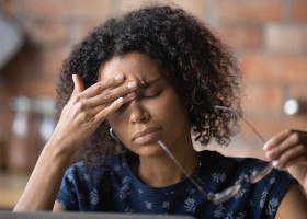 Woman experiencing a headache